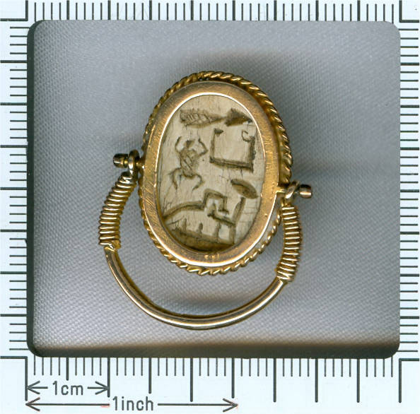 Typical Egyptian scarab ring with cartouched scarab set in gold swivel ring (image 14 of 15)